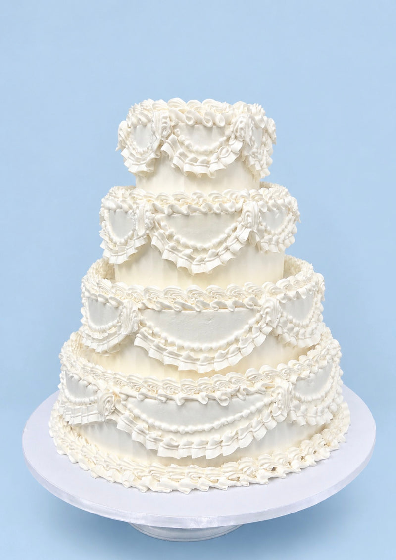 Four-tier vintage piped wedding cake
